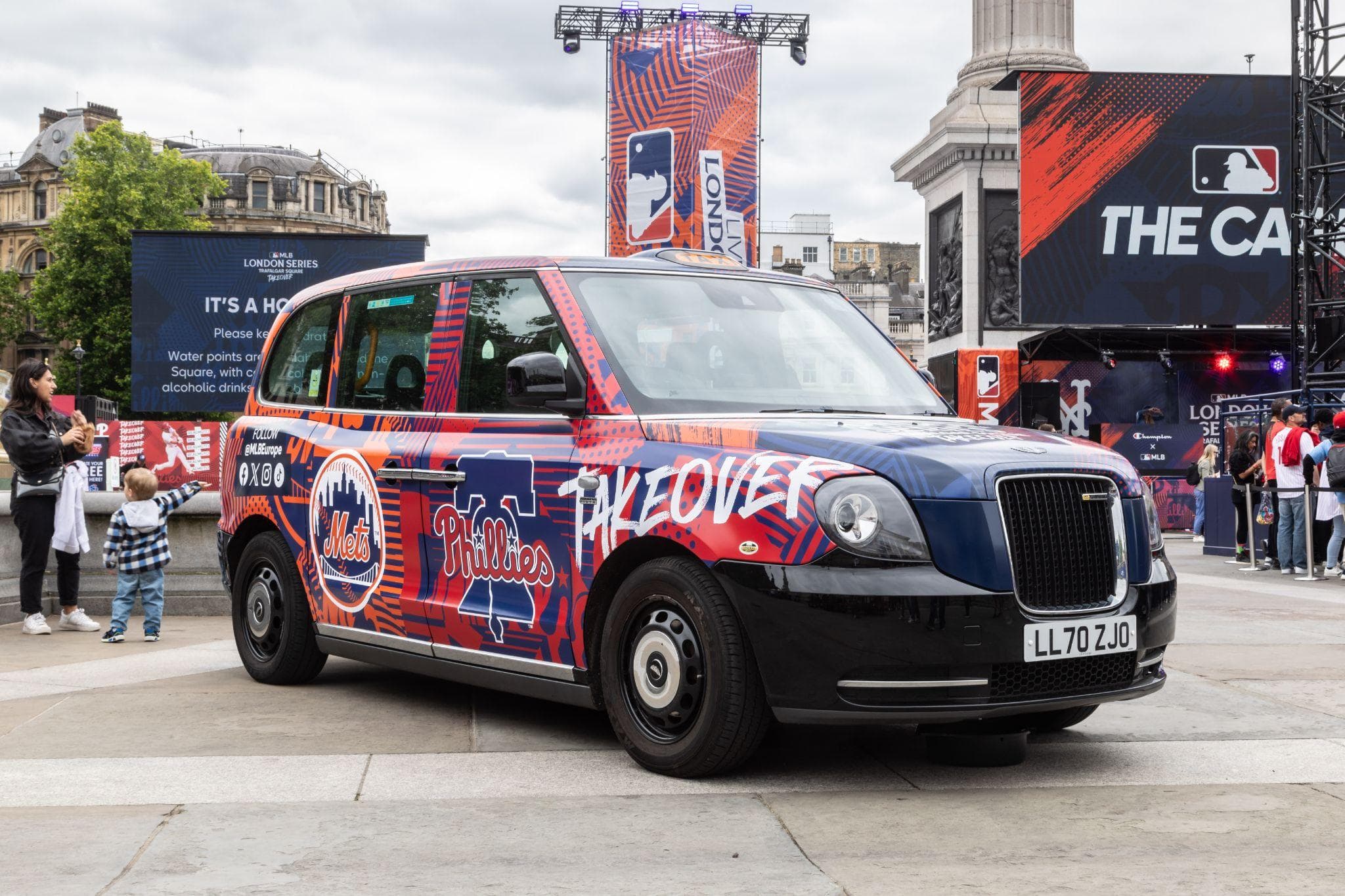 A Major League Baseball London Series full wrap on an electric black cab at a Trafalgar Square event site